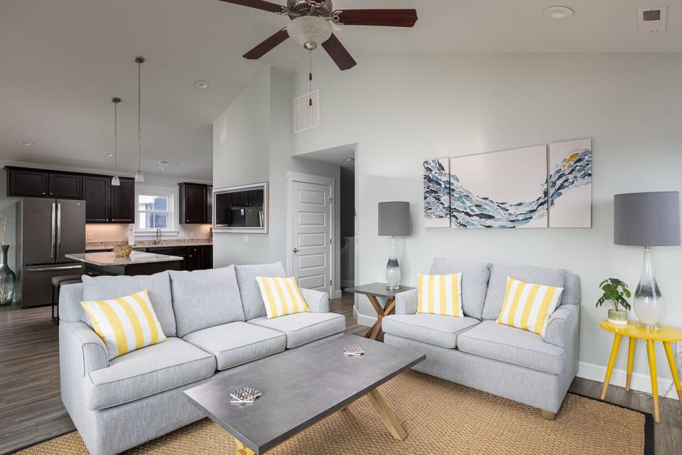 Top floor living area open to kitchen and dining.