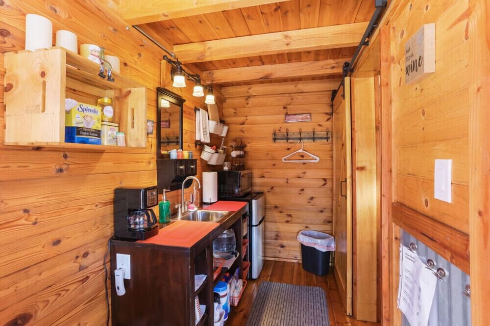 Refrigerator and freezer, microwave and coffee pot. 