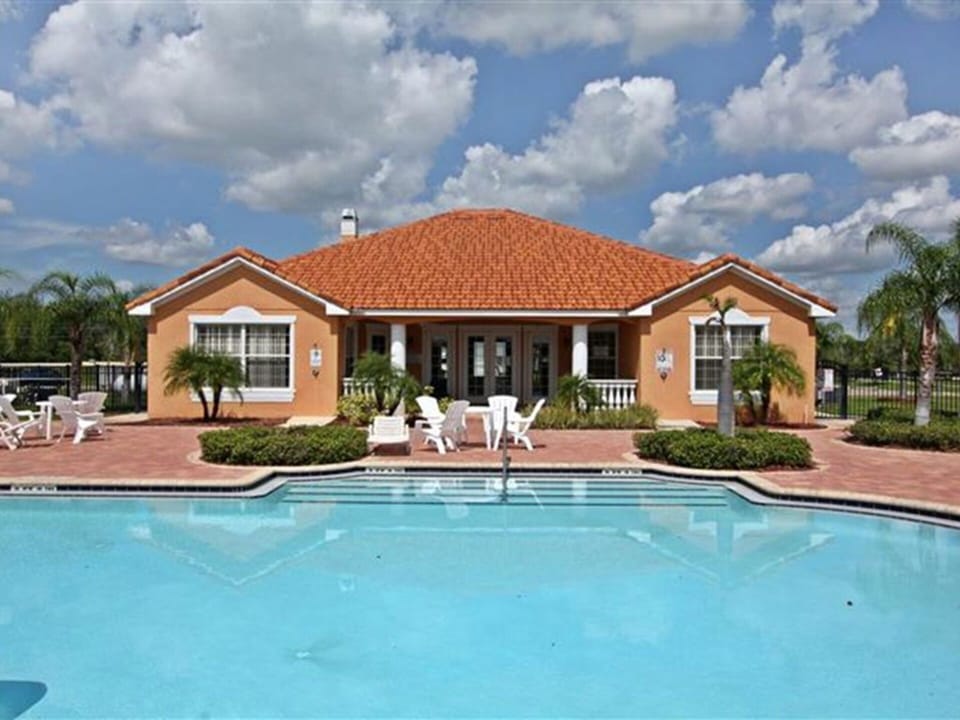 Community Clubhouse Heated Pool and Spa back and side entrance View