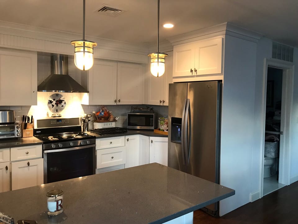 kitchen has six burner stove top, dishwasher, microwave,  reg/pod coffee maker 