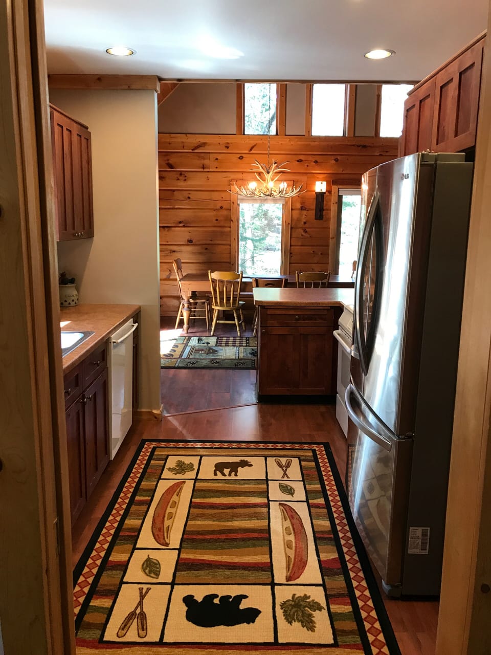 View of the kitchen looking toward the open concept Dining/Living and outdoors