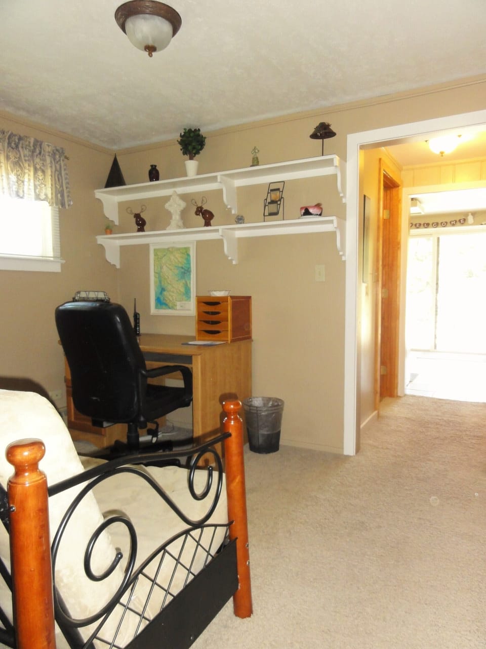 Office area with a full futon bed. 