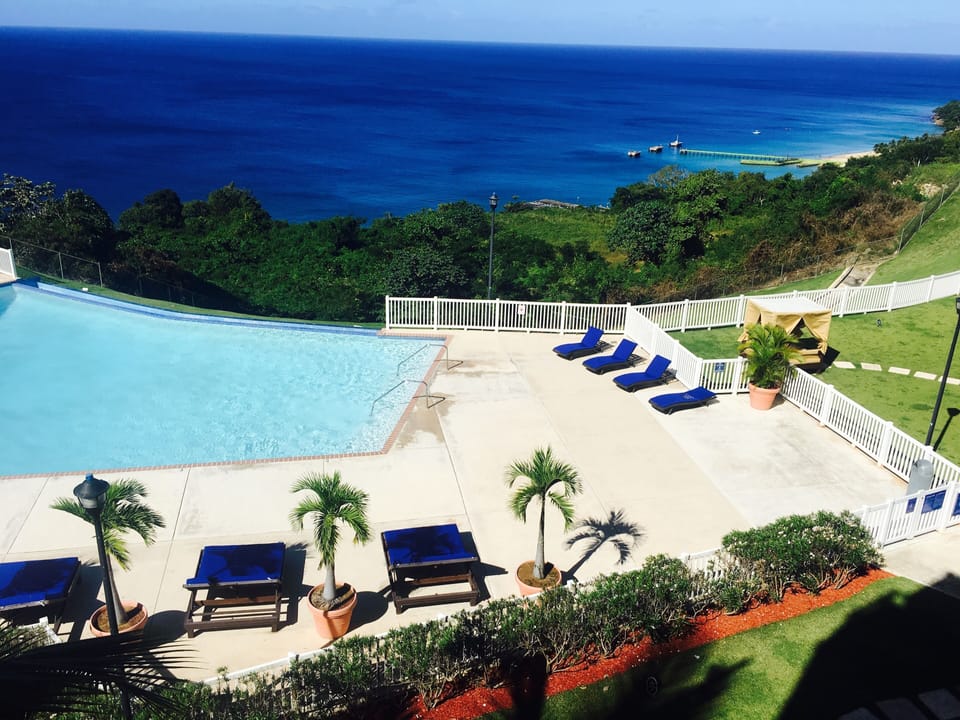 Breathtaking View of Infinity Pool and Crashboat Beach from our Balcony.