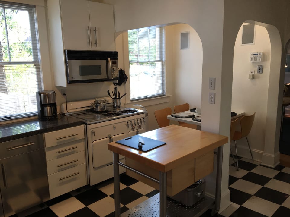 Kitchen looking West-vintage Chambers stove.  China and stainless for 12. 