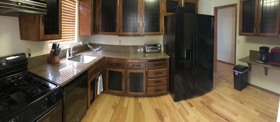 Good sized kitchen fully stocked with spices, pots and pans, dishes, etc