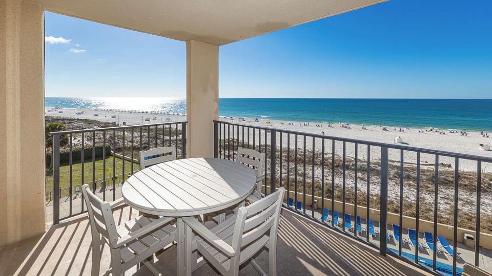 Your balcony seats four as you soak in warm sunlight and vibrant gulf coast views