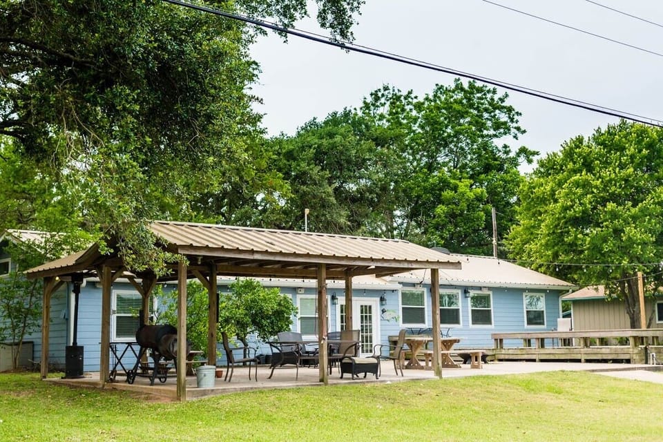 Covered BBQ area and outdoor dining area. Picnic tables and large deck as well.
