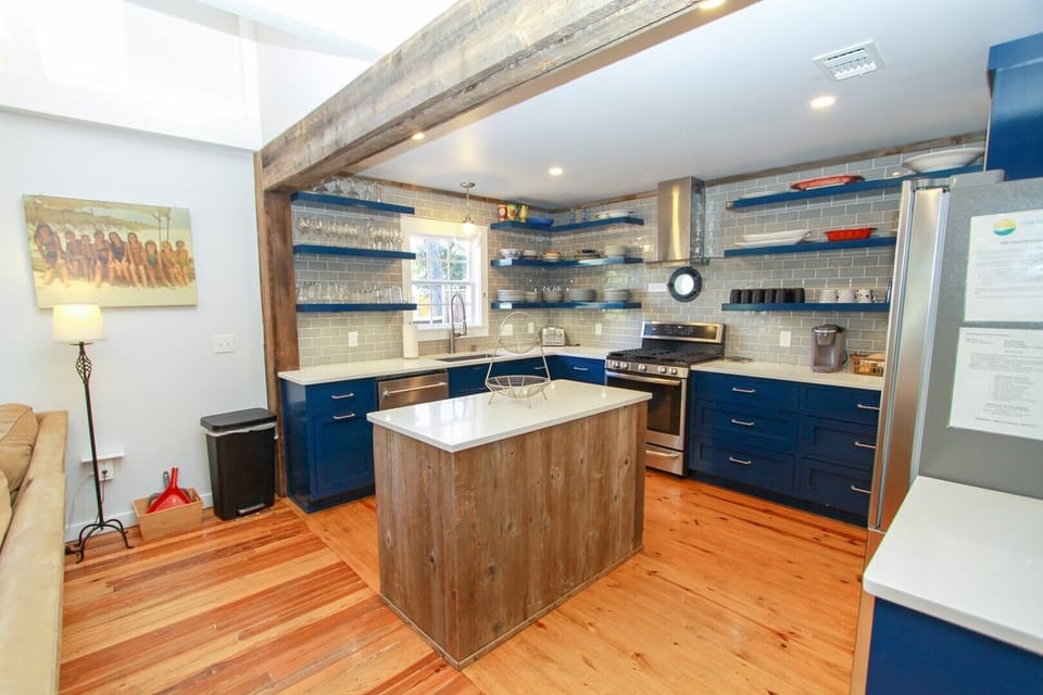 Kitchen Features Open Shelving and Tile Splash