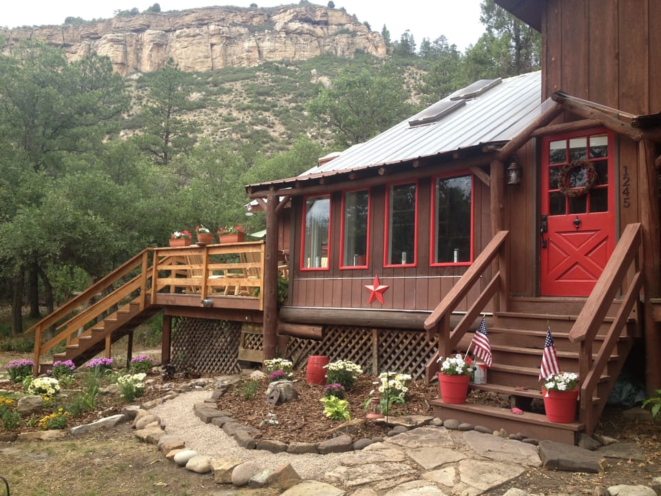 Welcome to our country cabin w/ views galore from wrap around deck & sunroom.