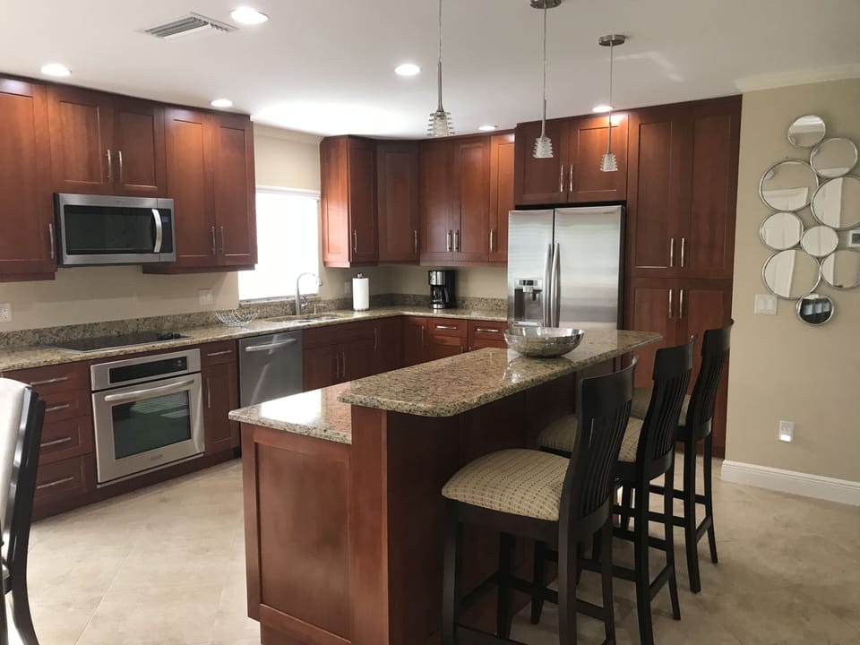 Large kitchen with ample prep space and bar area