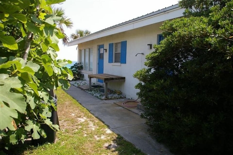 Shady side of Casa de Sounion, with extra outdoor shower.