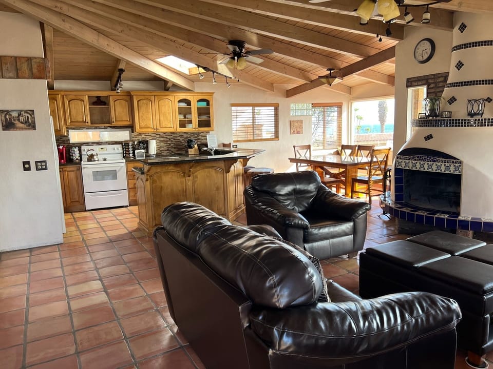 Vaulted ceilings & sunroofs provide sunlight in living room, kitchen & dining rm