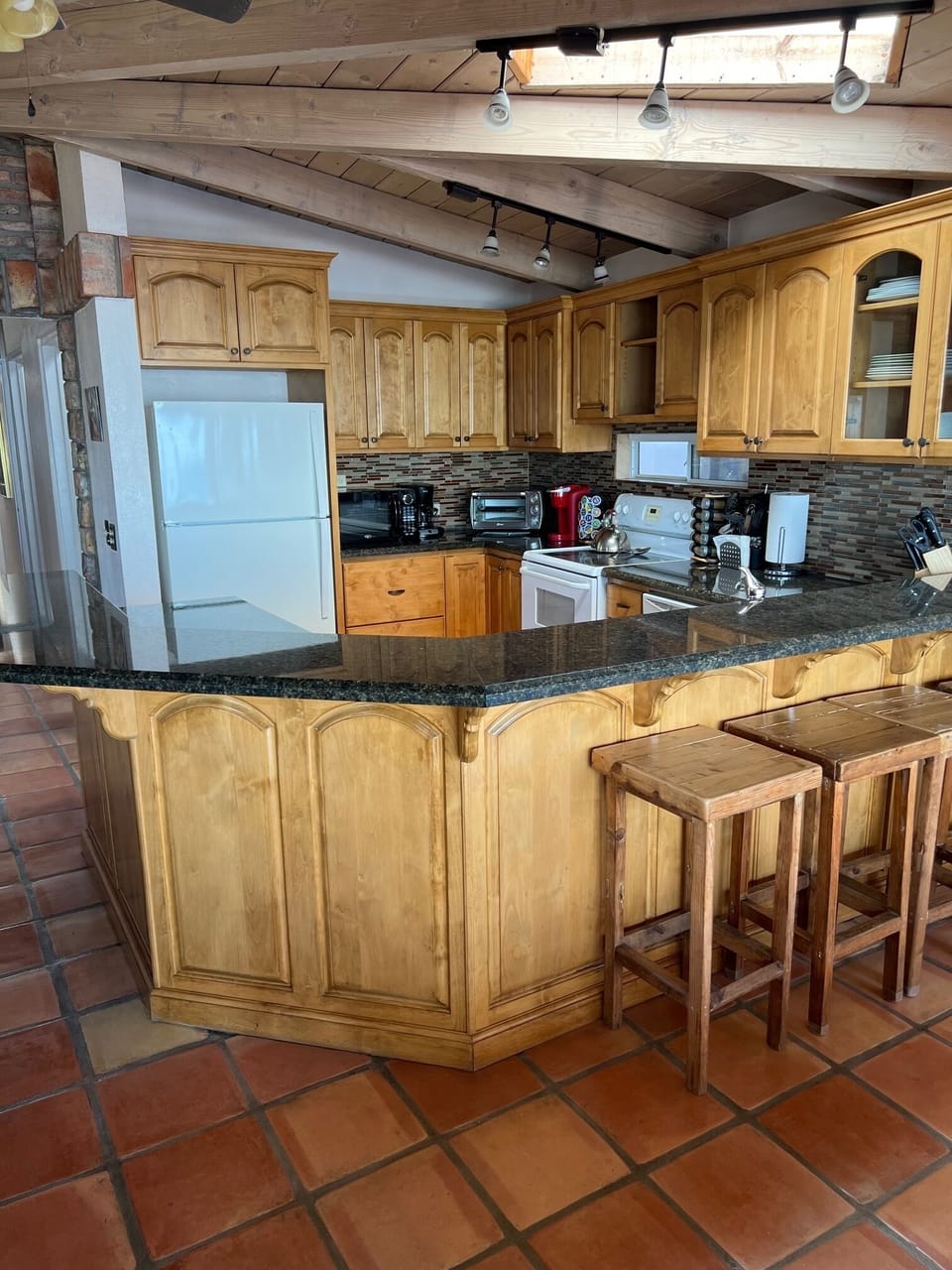 Recently remodeled kitchen with custom wood cabinets & granite countertops. 