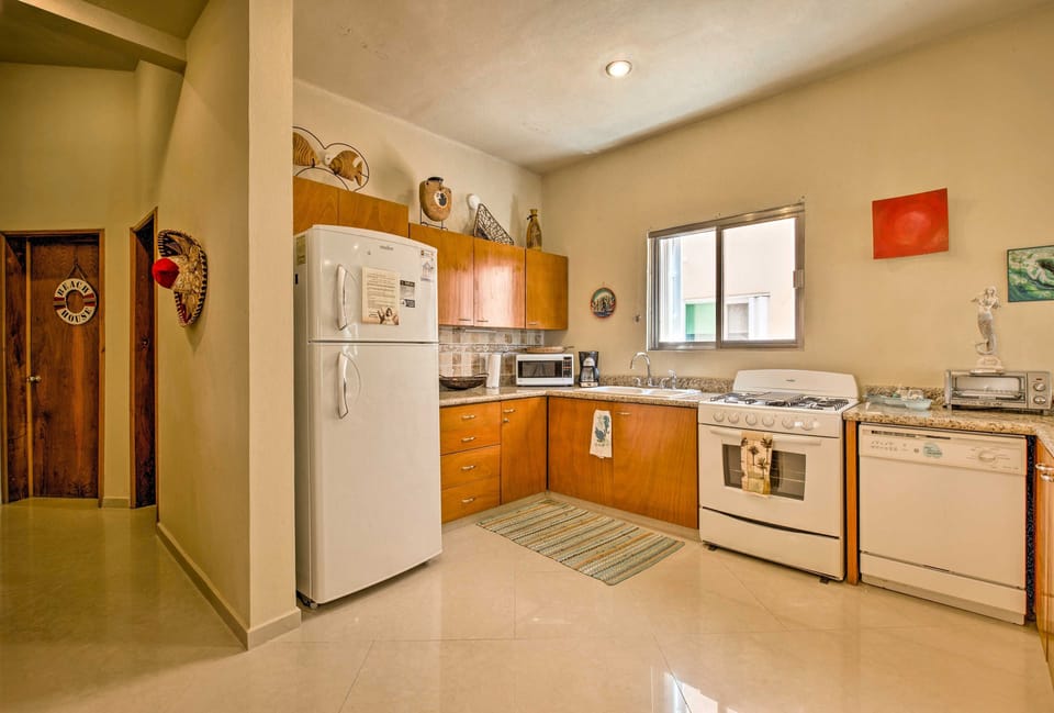 Walk down the hall from the 1st bedroom into the fully equipped kitchen.