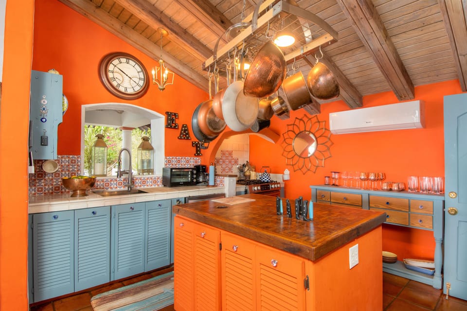 The country style kitchen with everything you might need is next to living room