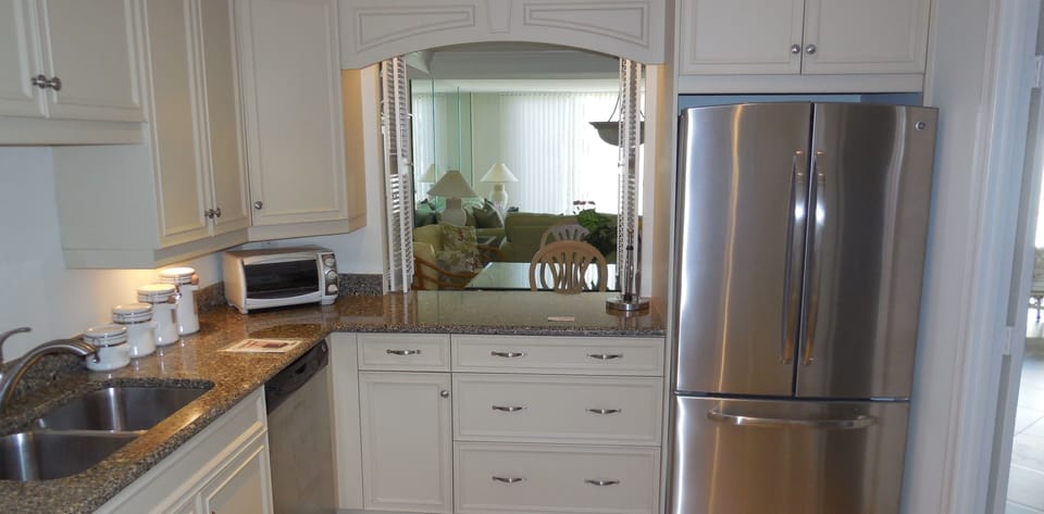 Kitchen with a pass through to dining room.