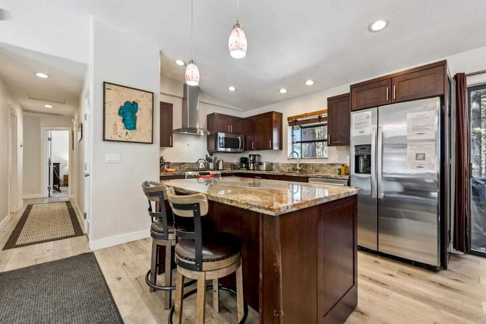 Beautifully remodeled custom kitchen stocked for serious cooking, with upgraded appliances, extensive cookware, quality knives, small appliances, dinnerware, and serving pieces.