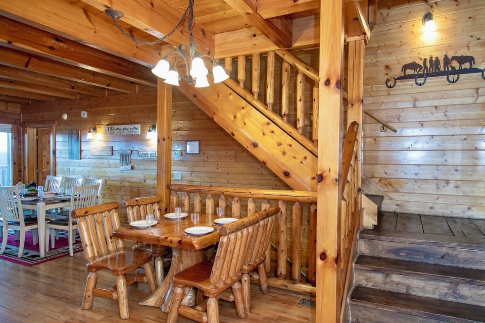 Main floor entry, open living/dining/ kitchen, sleeper sofa, fireplace, TV deck