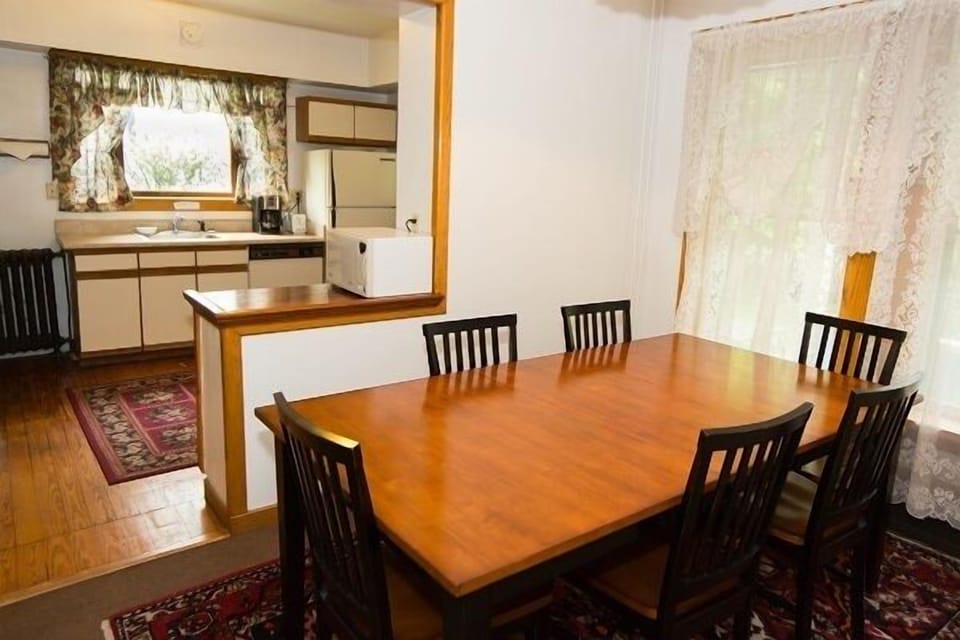 Village Suites dining room #1 Kitchen in background