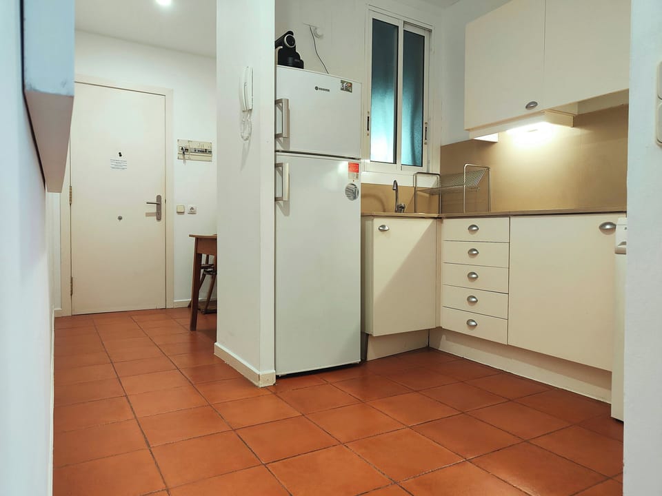 The apartment features a fully equipped kitchen ,which also boasts ample cabinet and drawer space.