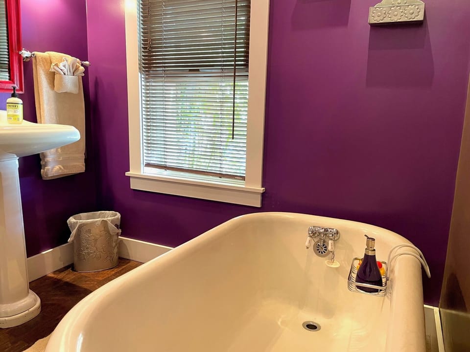 Bathroom with claw foot tub to relax in.