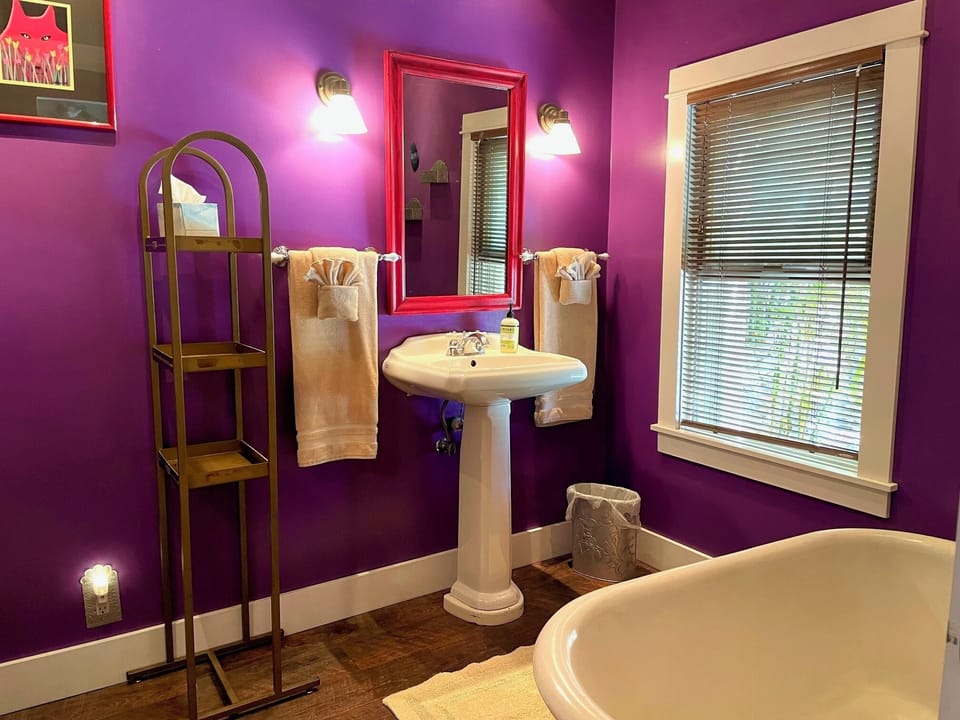 Spacious bathroom with claw foot tub.