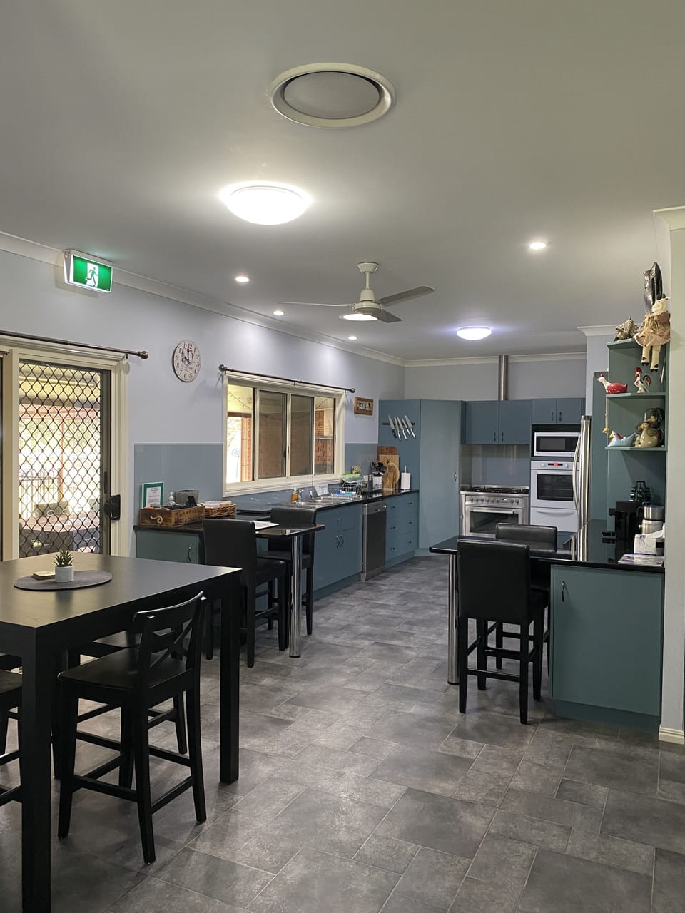 Rear entry glass sliding door & security screen on left into Kitchen 