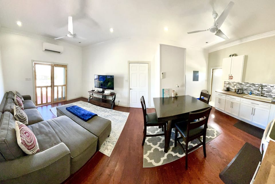 Living on left and kitchen on right, bedrooms and bathrooms on each end.
