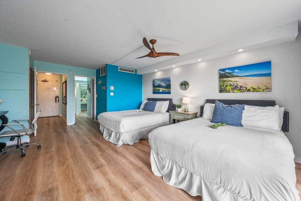 Perfect for sharing, this bedroom includes two comfortable queen beds