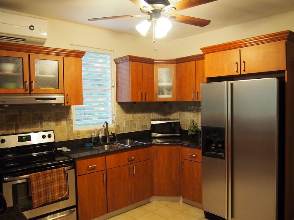 Updated kitchen with granite counter tops and stainless steel appliances