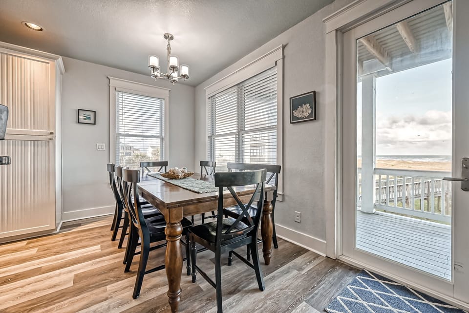 Inside Dining area with large farm table, chairs, and bench