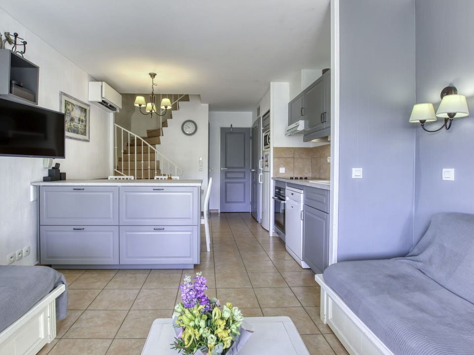 Furniture, Cabinetry, Building, Drawer, Countertop, Purple, Picture Frame, House, Plant, Flower