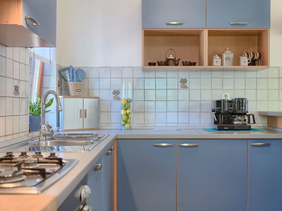 Countertop, Room, Property, Kitchen, Cabinetry, Tile, Furniture, Green, Interior Design, Yellow
