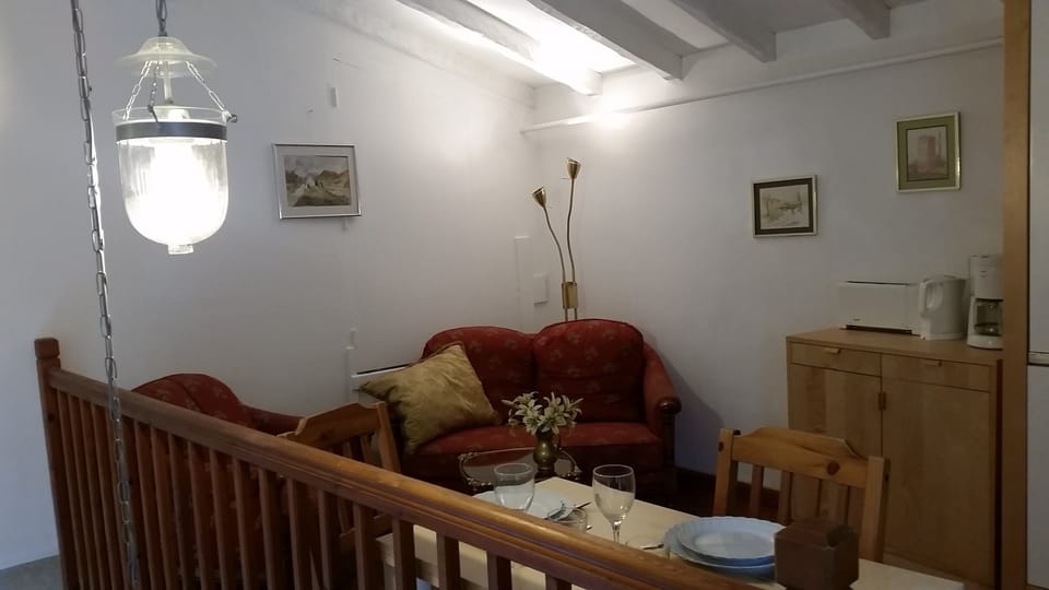 living area with dining table on the gallery
