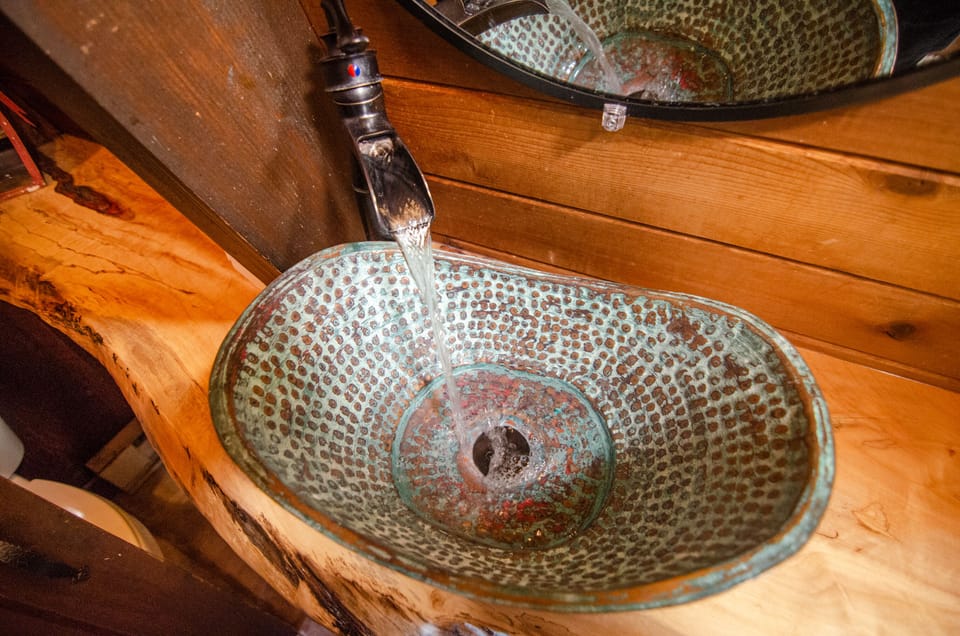 Upstairs Bathroom Copper sink in Live Edge wood countertop