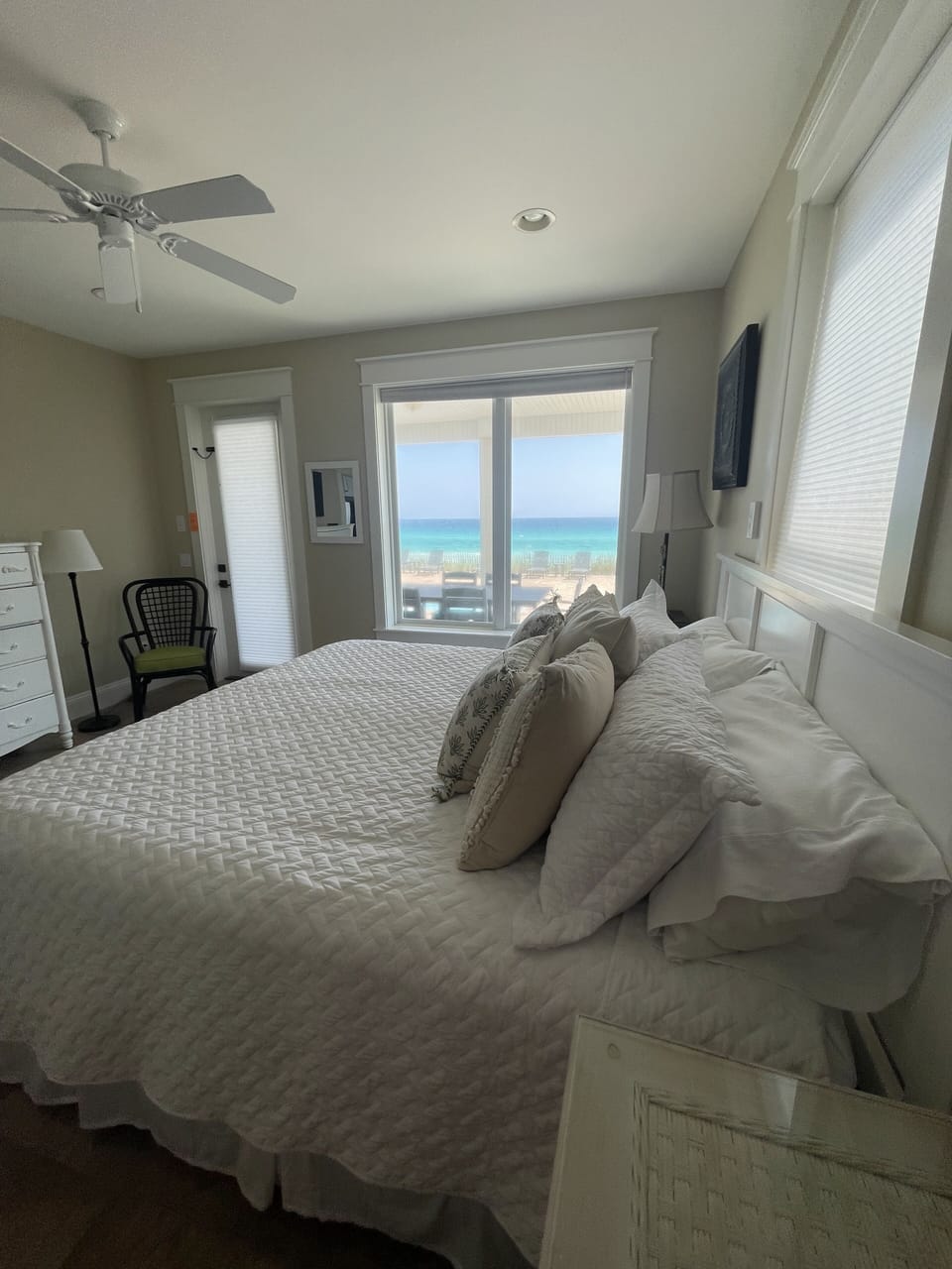 King bedroom with pool and ocean views and private access to porch by the pool.