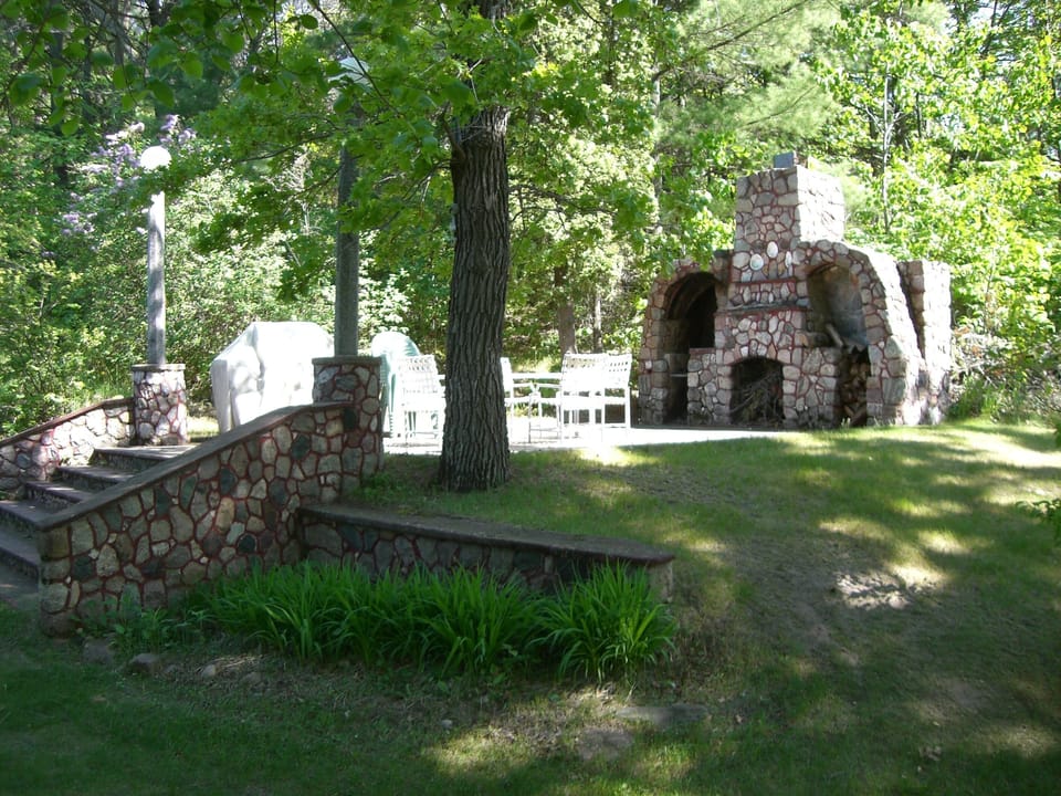Outdoor fireplace/patio is perfect for a cozy northwoods evening get together.