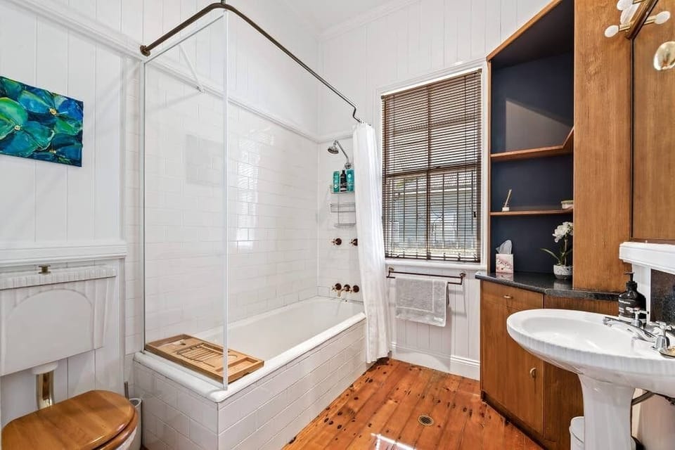 Main bathroom with shower, bath, vanity and toilet