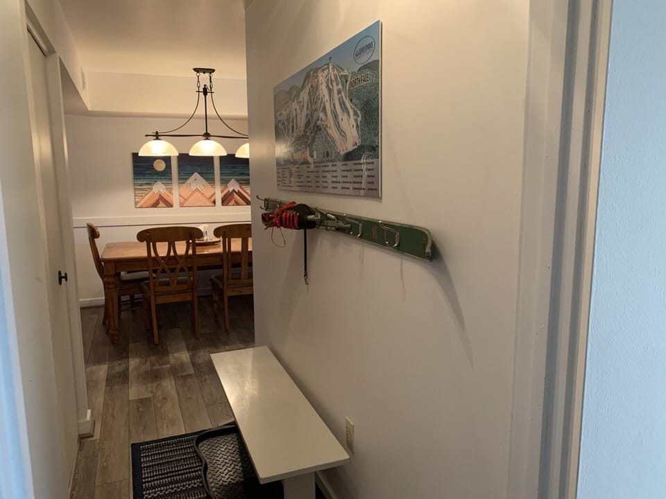 Ski coat rack in the foyer plus a large map of the ski trails.