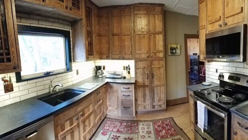 Down to the studs kitchen renovation with barnwood cabinets