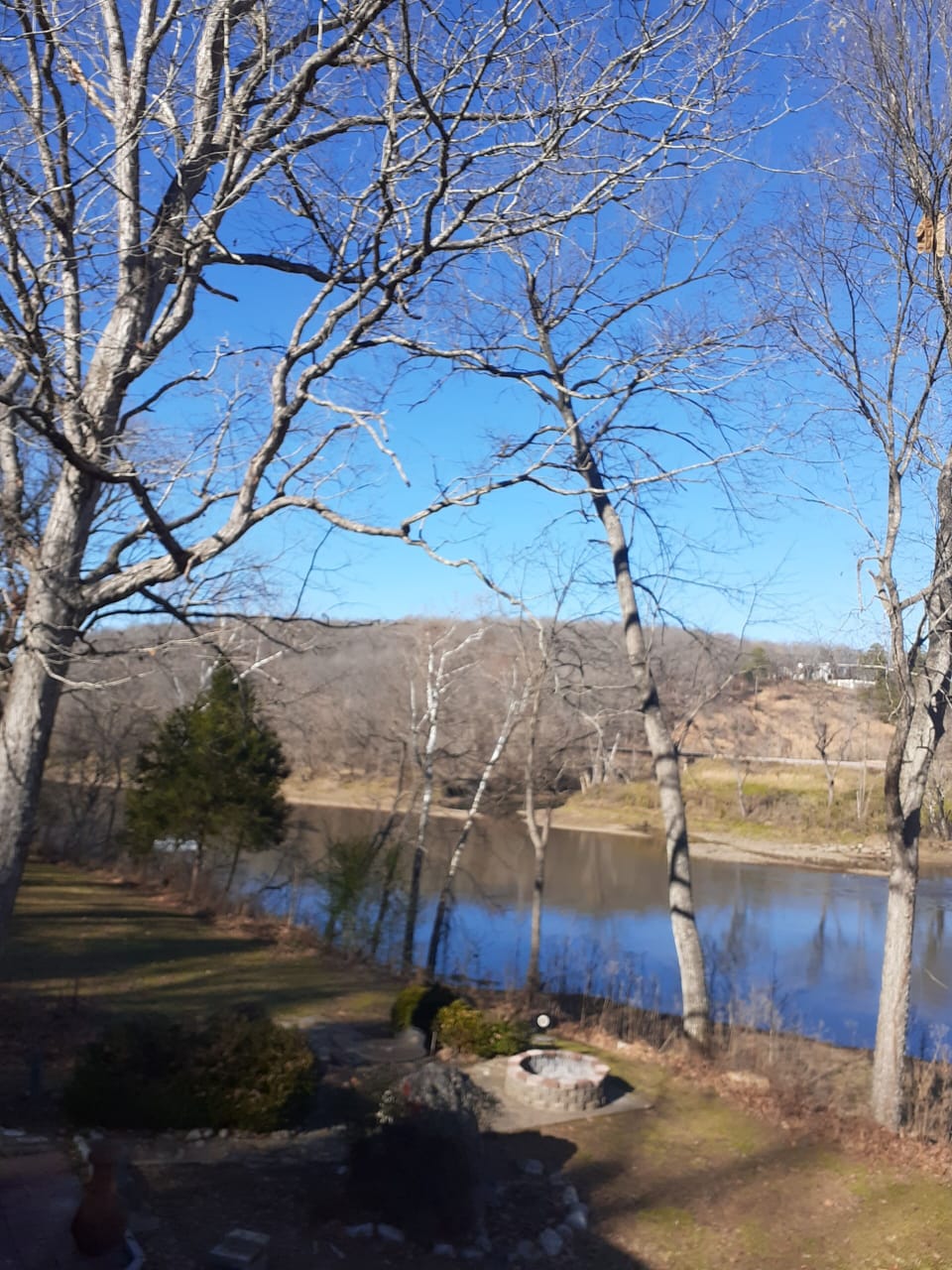 Upper deck overlooking The White River and floating boat dock. 