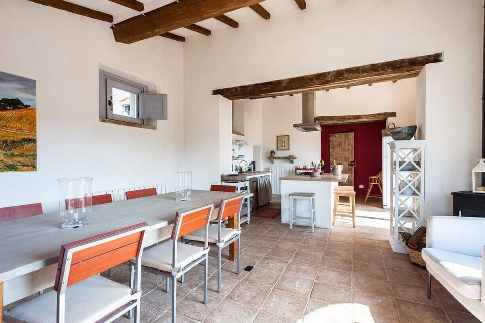 Dining Room with long table & wood burner.