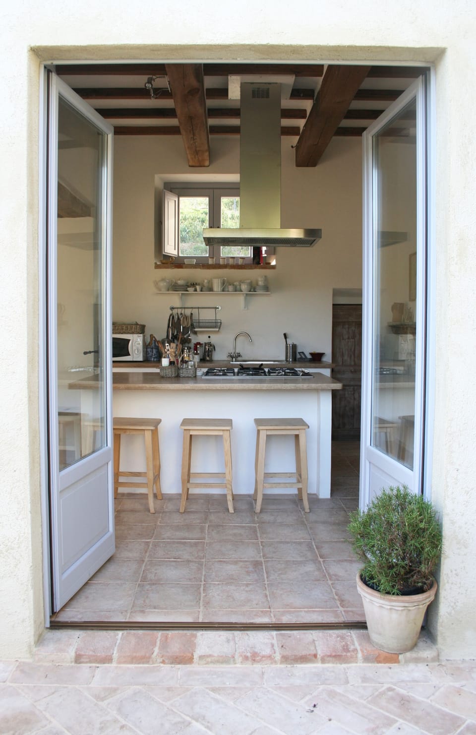 French doors out from Kitchen onto breakfast terrace.
