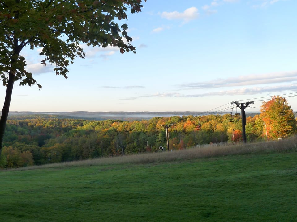 View from back deck, peak colors around the corner! (fog over Lake Bellaire)