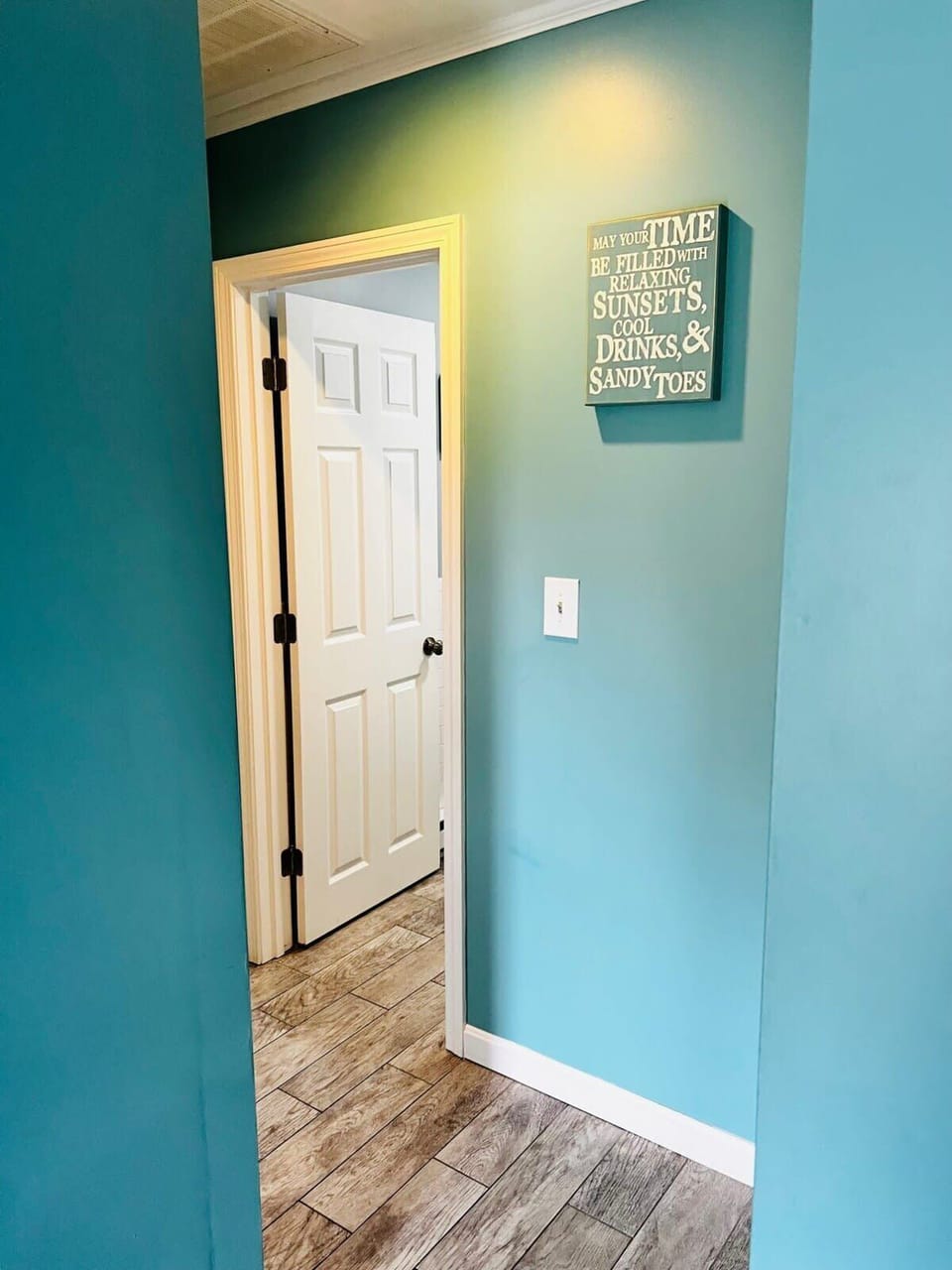 Hallway from the living room to the Bathroom and Bedrooms