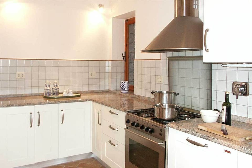 The modern kitchen has all you could need including an Italian stone work surface