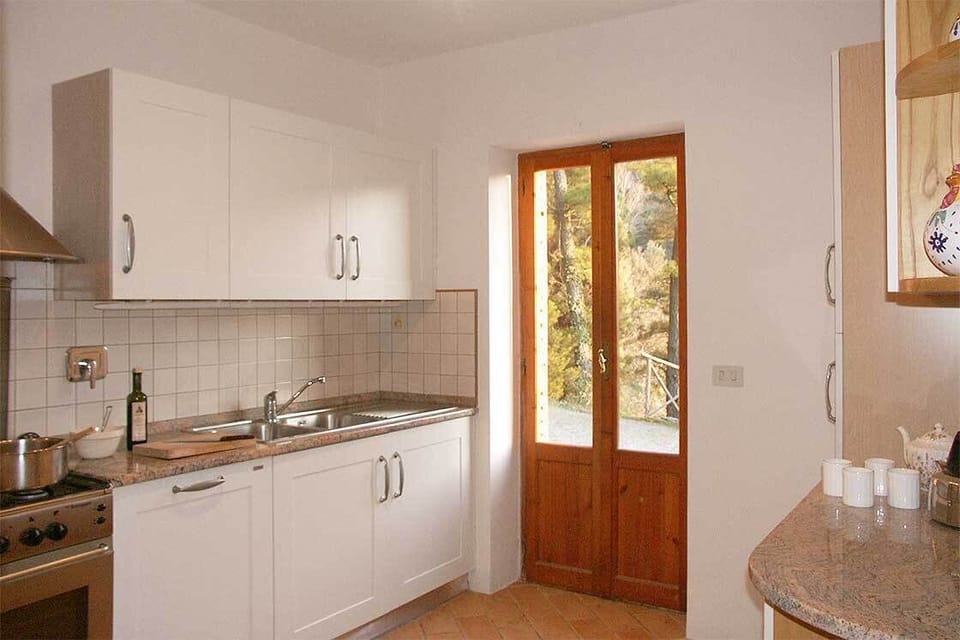 The modern kitchen has all you could need including an Italian stone work surface