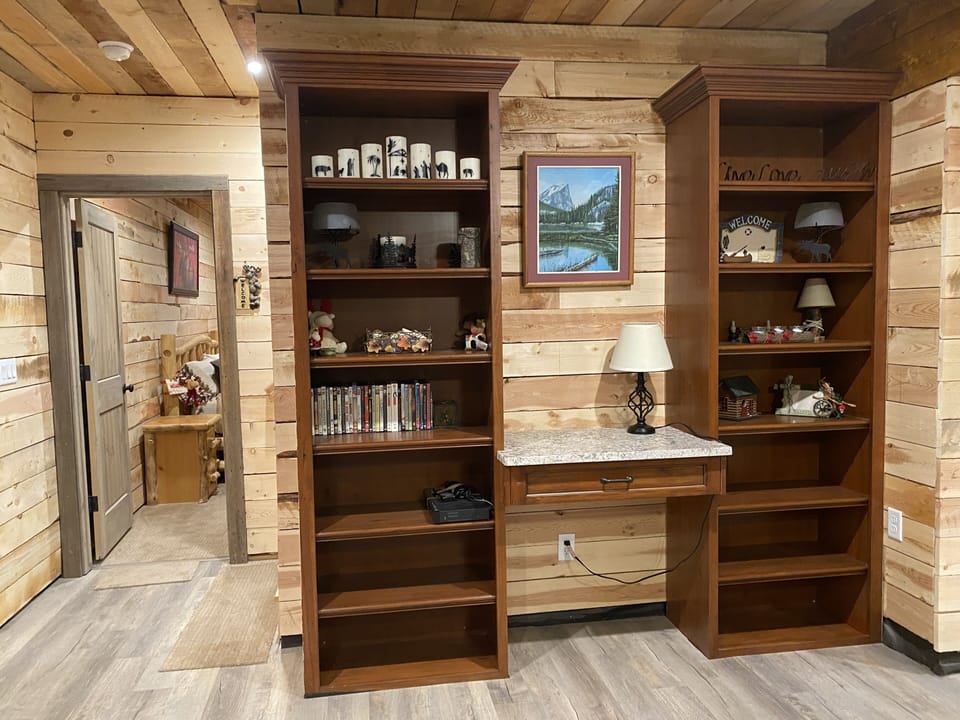 Lower level Family Room, Desk, Bookshelves DVDs, Books, Large TV, kitchenet