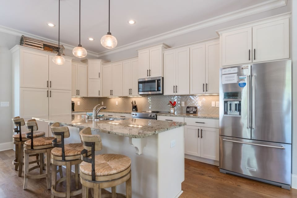 Granite counter tops, stainless steel appliances, 4 seats at island