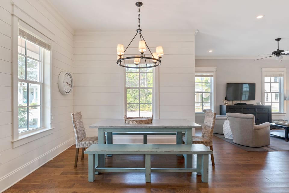 Large dining table, seating for 8, plus 4 seats at island in kitchen